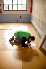 Young architect boy working on a blueprint