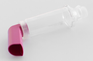 Lung medication with corticosteroids for asthma or COPD. An inhaler with spacer with white...