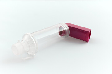Lung medication with corticosteroids for asthma or COPD. An inhaler with spacer with white background