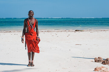 Maasai warrior on the beach Diani Beach, Kenya Mombasa - obrazy, fototapety, plakaty