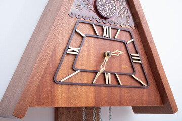 Vintage cuckoo clock isolated for creative background.
cuckoo clock hanging on the wall.