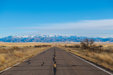 Arizona Route 186 with snow covered Chiricahua Mountains at the background near Chiricahua National...