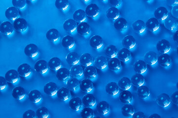 Glass balls on a blue background as a background for the image