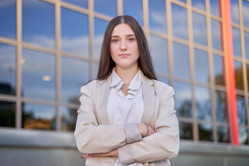 Closeup portrait, young professional, beautiful confident woman wearing a power suit, friendly personality,