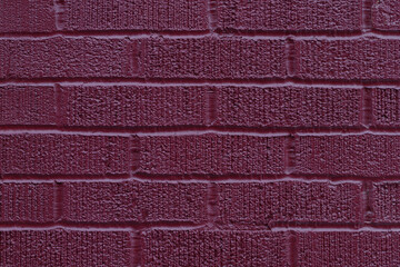 Close up of painted pink brick wall texture background.