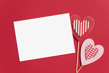 Valentines day card mockup and hearts on red paper background