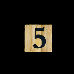 number 5 five wooden isolated on black background.