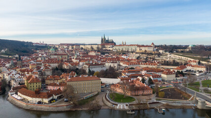Obraz premium Aerial view of River and buildings in Old Town of Prague, Czech Republic. Drone photo high angle view of City