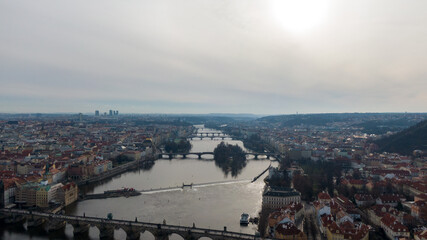 Obraz premium Aerial view of River and buildings in Old Town of Prague, Czech Republic. Drone photo high angle view of City