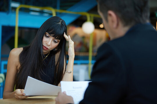 Woman Applicant Feeling Nervous And Headache When Hr Recruitment Officer Holding Resume And Asking Something At Job Interview, Considering Employee Candidature For Open Work Position