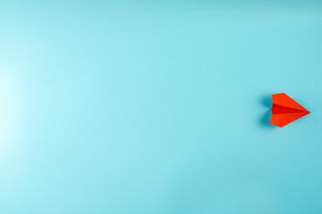 Paper airplane red on blue background Concept of travel, the route of the paper airplane.