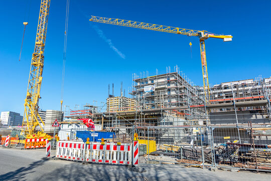 Construction site with cranes on a sunny day in Tübingen, Germany (editorial)