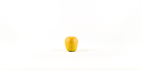 Fresh ripe yellow apple on white background isolated. Ripe apple full depth of field.	
