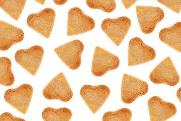 Shortbread cookies in the form of hearts on a white background. Valentine's Day pattern. Flat lay