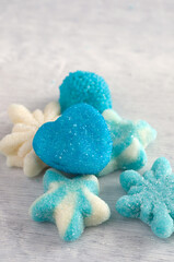 Macro Image of Various Blue Soft Candies on Old Wood Board