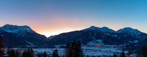 sunset above the city of ehrwald