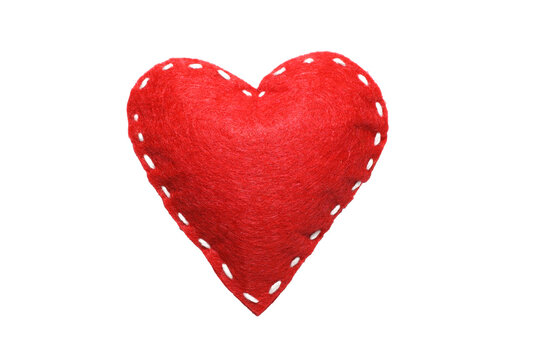 Red felt heart with white stitches. A symbol of love handmade sewn with thread around the edge isolated on a white background.	