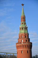 Moscow Kremlin tower decorated by the ruby star at blue sky background