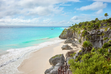 Rocky cliff at the tropical beach of Tulum, Yucatan Peninsula, Mexico. - 566371189