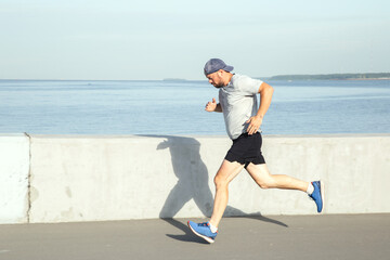 Sports activity of a man on the waterfront