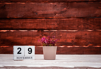 November calendar with number  29. Planner copy space on a wooden brown background. March number...