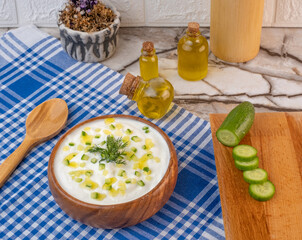 Traditional Greek or Turkish Yogurt Sauce in A Bowl On Marble Background.  Kitchen Concept Tzatziki on Marble Floor. (Turkish name: Cacik)