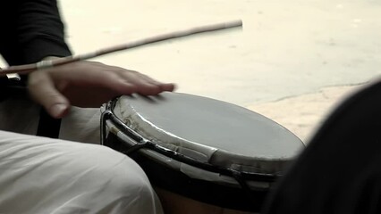 Man Playing Latin Drum. Close Up.  