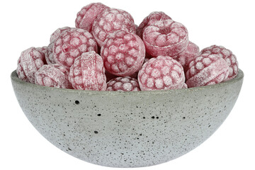 raspberry candies in a concrete bowl isolated on white background