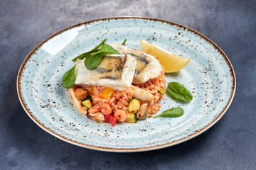 white fish with rice and vegetables