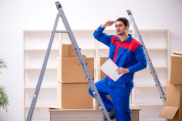 Young male contractor doing home relocation