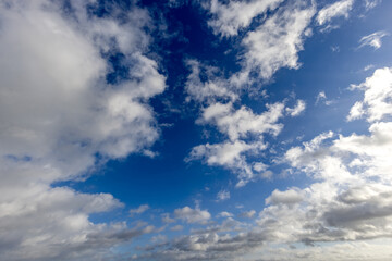 Naklejka na ściany i meble Blue sky background with clouds