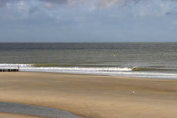 Fototapeta na wymiar Beautiful sea view with waves on the beach of Breskens
