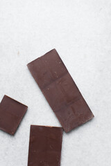 dark chocolate bars for baking on a chopping board, Dark chocolate about to chopped into pieces