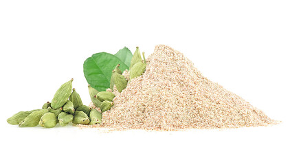 Pile of ground cardamom, green leaves and whole capsules of cardamom, isolated on a white background.