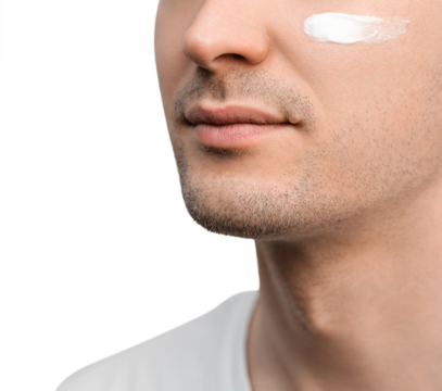 A portrait of a handsome man with a stubble in a white t-shirt, sample of a face cream on his cheek.