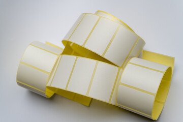 Rolls of white labels isolated. Labels for direct thermal or thermal transfer printing. Blank...