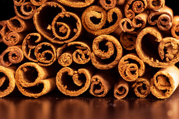 Cinnamon sticks spice closeup background. Texture of cinnamon sticks. Top view.