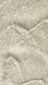 Gentle abstract shallow waves flowing over shifting sand