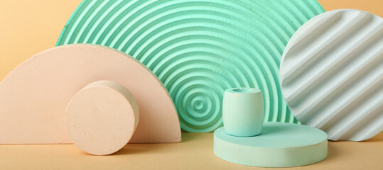 Empty modern podiums on beige background