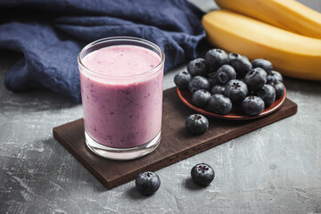 Blueberry and banana smoothie drink in a glass, healthy eating concept