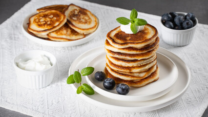 Breakfast pancakes with blueberries and sour cream
