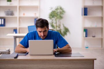 Fototapeta premium Young male doctor in telemedicine concept