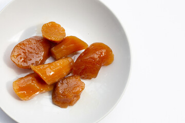 Sweet​ potato​ in syrup in white plate