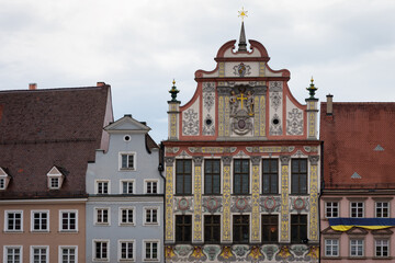 Landsberg am Lech, famous medieval village over the bavarian romantic road. Detail of the town hall facade with colorful houses - 566398784