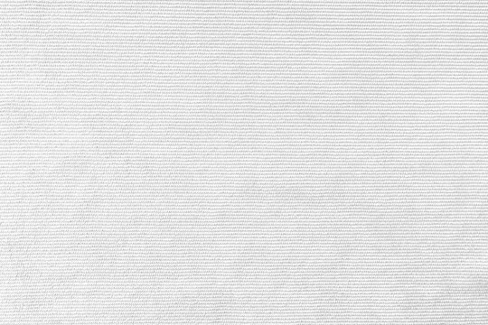 Texture background of velours white fabric. Upholstery velveteen texture fabric, corduroy furniture textile material, design interior, decor. Ridge fabric texture close up, backdrop, wallpaper.