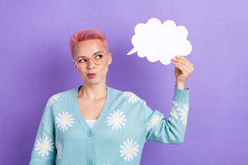Portrait of thoughtful cute girl with pink hairdo wear blue pullover eyewear hand hold paper cloud isolated on violet color background