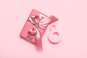 Beautiful gift and paper figure 8 on pink background. Women's Day celebration