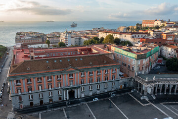 Fototapeta na wymiar Aerial View of Historic Buildings and Cargo Ships off of the Coast of Naples Italy