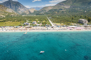 Part of shore of 7 km long beach with turquouise water in village Borsh, Albania in Summer 2022