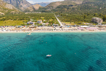 Part of shore of 7 km long beach with turquouise water in village Borsh, Albania in Summer 2022